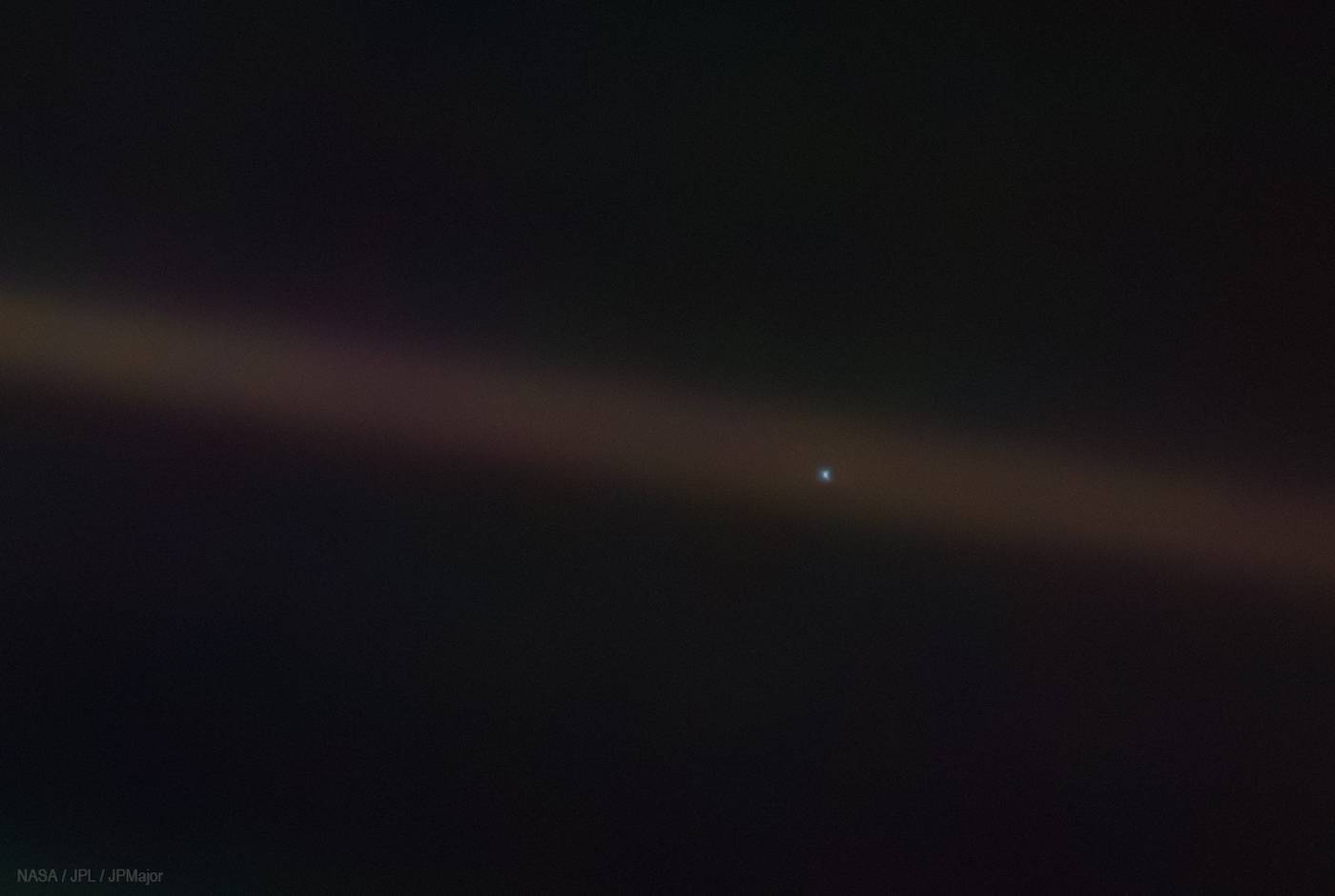 distant image of the earth taken by the Voyager 1 spacecraft in 1990 distant image of the earth taken by Voyager 1 spacecraft in 1990